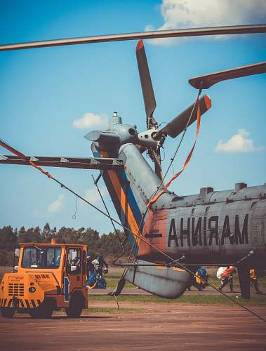 electrical device gray and Marinha aircraft under blue sky during daytine pirassununga